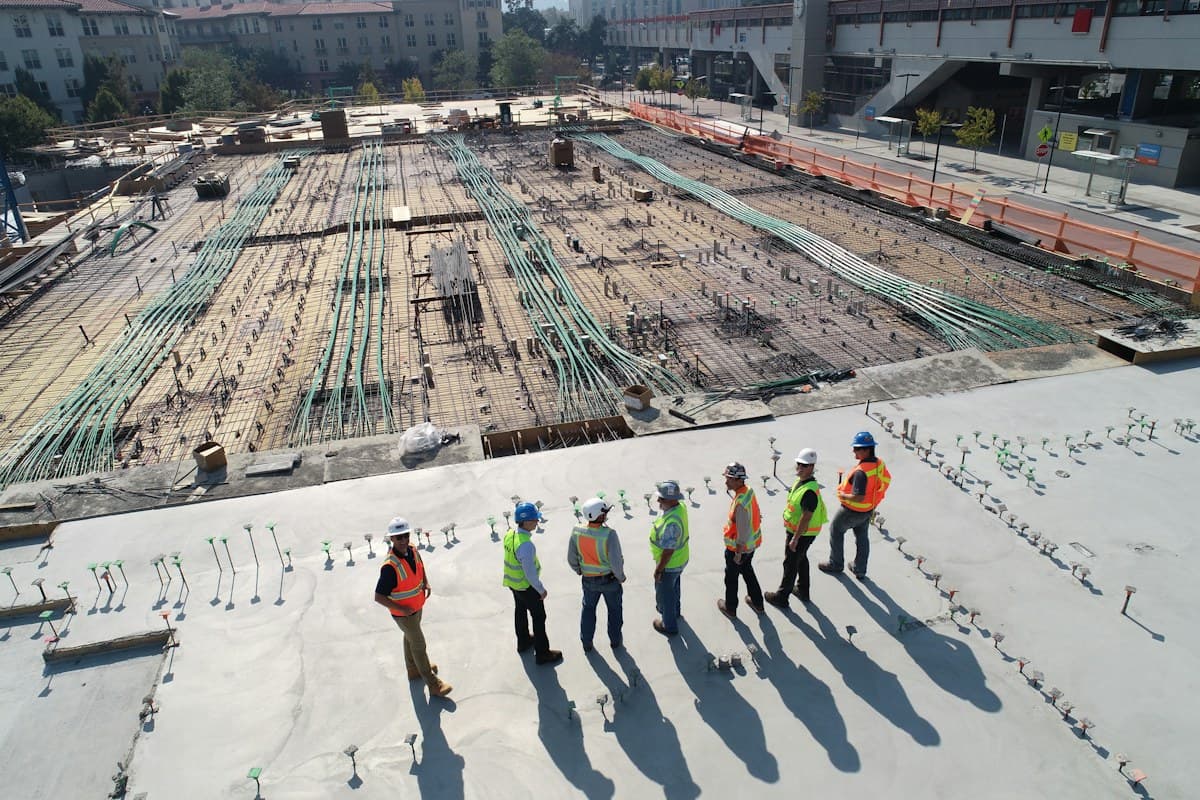 Workers preparing a large concrete construction site