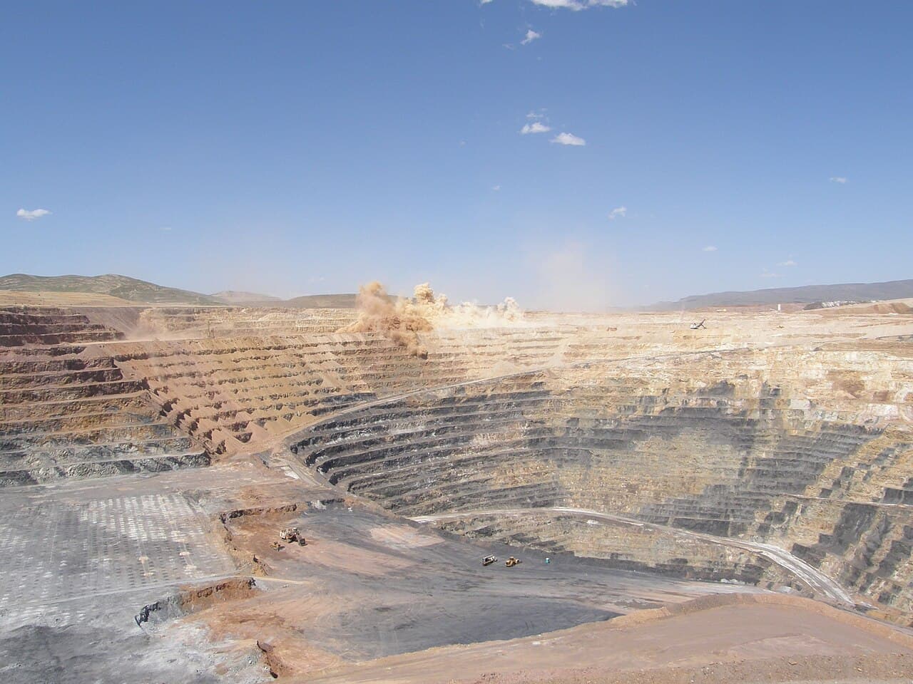 Illustrative open-pit mine showing stepped excavation benches